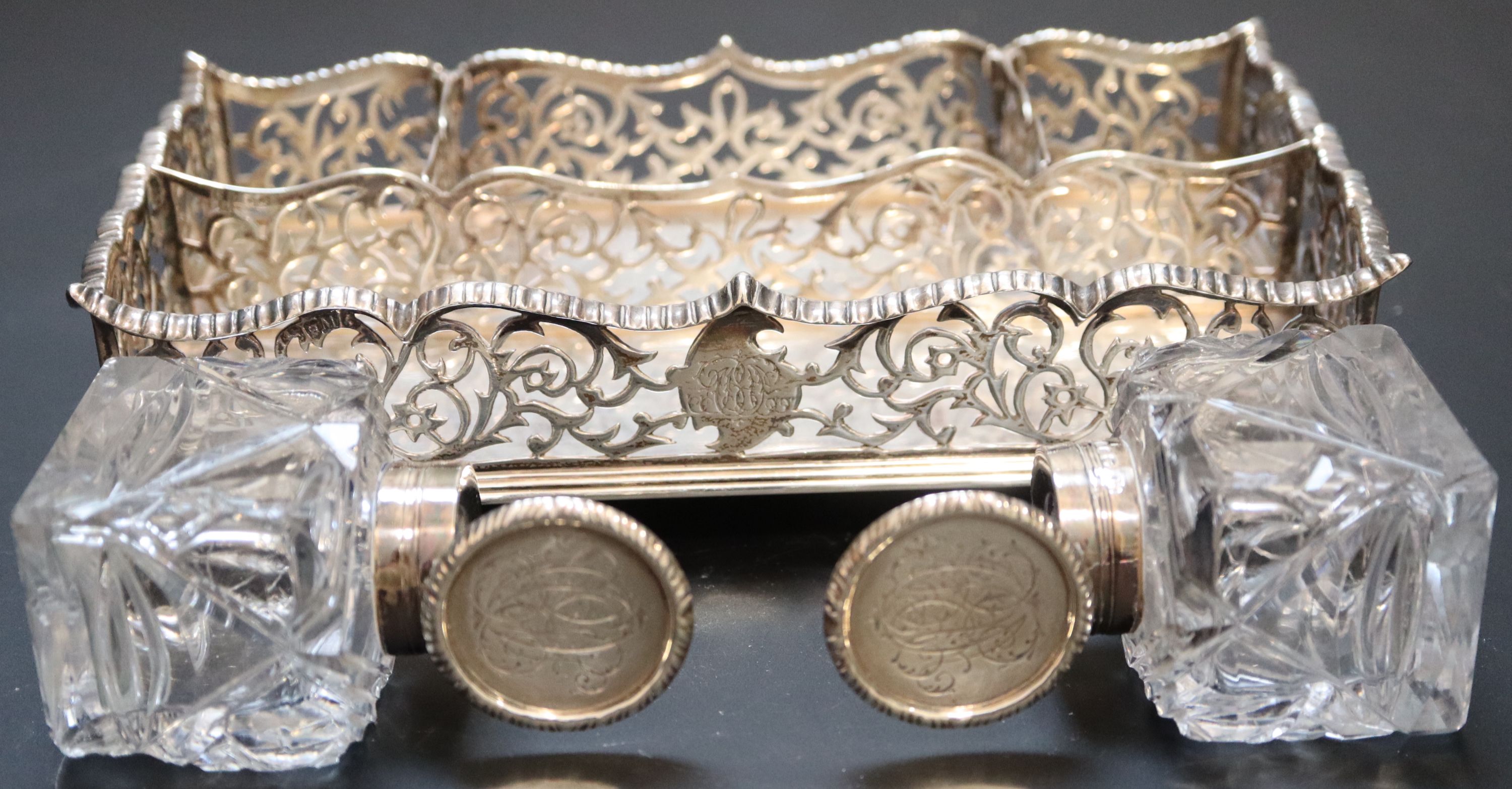 A Victorian silver rectangular inkstand with pierced gallery and two glass wells, Charles Stuart Harris, London, 1886/7, 18.7cm,